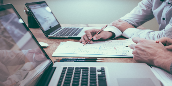 Two people working on a document